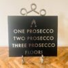 One Prosecco plaque